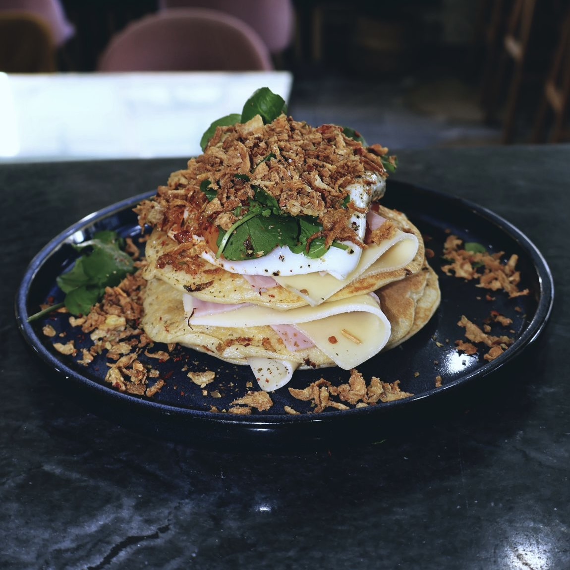 Three homemade pancakes, Flemish cheese, ham, bacon, fried egg, fried onion